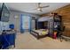 Bright bedroom featuring a ceiling fan, a bunk bed, a desk, and ample space at 1978 S Old Mill Dr, Deltona, FL 32725