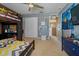 Bedroom featuring a bunk bed, a ceiling fan, a desk, a closet, and natural light at 1978 S Old Mill Dr, Deltona, FL 32725
