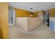 A large bonus room featuring neutral carpet, textured walls, and an ambient light fixture at 1978 S Old Mill Dr, Deltona, FL 32725