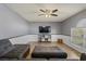 Living room complete with modern decor, a comfortable sectional, a flat-screen TV, and a window at 1978 S Old Mill Dr, Deltona, FL 32725