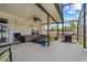 Comfortable screened-in porch area with ceiling fan and outdoor seating, ideal for relaxation and entertaining at 1978 S Old Mill Dr, Deltona, FL 32725