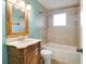 Bathroom featuring a vanity sink, tiled shower and bathtub combo at 201 W Central Ave, Orange City, FL 32763