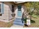 Inviting home entrance with blue door, flowers, and walkway, creating a warm welcome at 201 W Central Ave, Orange City, FL 32763