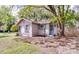 Charming home featuring light-colored siding, blue shutters, and flower boxes under the windows at 201 W Central Ave, Orange City, FL 32763