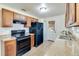 Well-lit kitchen featuring granite countertops, and modern appliances at 201 W Central Ave, Orange City, FL 32763