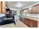 Kitchen featuring stone countertops, stainless steel appliances, and wooden cabinets at 201 W Central Ave, Orange City, FL 32763
