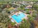 Aerial view of the community pool featuring ample seating and greenery at 203 W Tarrington Dr, Deland, FL 32724