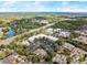 An aerial view highlighting the neighborhood's proximity to commercial centers, lakes, and roadways at 203 W Tarrington Dr, Deland, FL 32724