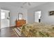 Bedroom featuring hardwood floors and a dresser at 203 W Tarrington Dr, Deland, FL 32724