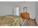 Bedroom featuring hardwood floors and a dresser at 203 W Tarrington Dr, Deland, FL 32724