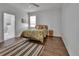 Bedroom with hard wood flooring, a window, and en suite bathroom at 203 W Tarrington Dr, Deland, FL 32724