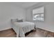 Bright bedroom with hardwood floors and natural light from the window at 203 W Tarrington Dr, Deland, FL 32724
