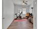 Bedroom featuring wood floors, ceiling fan, natural light, and exercise bike at 203 W Tarrington Dr, Deland, FL 32724
