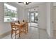 Bright breakfast nook with a sliding glass door and a window at 203 W Tarrington Dr, Deland, FL 32724