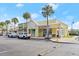 A brightly painted commercial building featuring an animal clinic and various retail storefronts at 203 W Tarrington Dr, Deland, FL 32724