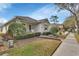 Charming one-story home featuring manicured landscaping and a well-maintained front yard at 203 W Tarrington Dr, Deland, FL 32724