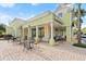 Exterior view of commercial building with tables and chairs at 203 W Tarrington Dr, Deland, FL 32724