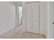 Hallway features tile flooring, closet, and entry to another room at 203 W Tarrington Dr, Deland, FL 32724