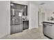 Kitchen featuring a stainless steel refrigerator and tile floors at 203 W Tarrington Dr, Deland, FL 32724