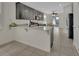Modern kitchen with granite countertops, stainless steel appliances, and ample cabinet space at 203 W Tarrington Dr, Deland, FL 32724
