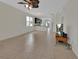 Open concept living area featuring tile flooring, ceiling fan, and natural light at 203 W Tarrington Dr, Deland, FL 32724