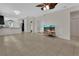 Expansive open concept living area featuring tile flooring and natural light at 203 W Tarrington Dr, Deland, FL 32724