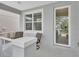 Inviting front porch with seating area, perfect for enjoying the outdoors at 203 W Tarrington Dr, Deland, FL 32724