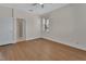 Bedroom with hardwood flooring, ceiling fan and a view of the en-suite bathroom at 214 Woodhouse Ln, Deland, FL 32724