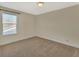 Bedroom with carpeted flooring, ceiling light and large windows at 214 Woodhouse Ln, Deland, FL 32724