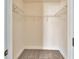 Walk-in closet featuring carpet and metal shelving for organizing clothes and personal items at 214 Woodhouse Ln, Deland, FL 32724