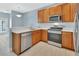 Modern kitchen with stainless steel appliances and light countertops at 214 Woodhouse Ln, Deland, FL 32724