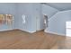 Bright living room featuring hardwood floors, tall ceilings, and plenty of natural light at 214 Woodhouse Ln, Deland, FL 32724