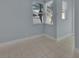 Bright living room featuring tiled flooring and large windows with natural light at 214 Woodhouse Ln, Deland, FL 32724