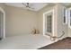 Covered patio featuring a ceiling fan, neutral color scheme, and space for seating at 214 Woodhouse Ln, Deland, FL 32724