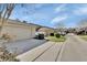 Residential street view showcasing well-maintained lawns, driveways, garages, and a sense of community at 214 Woodhouse Ln, Deland, FL 32724