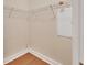 Walk-in closet with a wooden floor and wire shelving at 214 Woodhouse Ln, Deland, FL 32724