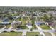 Neighborhood view showcasing well-maintained homes, green lawns, and tree-lined streets in a residential area at 2216 Umbrella Tree Dr, Edgewater, FL 32141