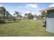 Spacious, green backyard featuring plenty of room to enjoy the outdoors at 2216 Umbrella Tree Dr, Edgewater, FL 32141