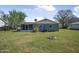 Nice backyard featuring green grass and a cozy patio area perfect for outdoor enjoyment at 2216 Umbrella Tree Dr, Edgewater, FL 32141