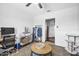 Comfortable bedroom with a modern desk, stylish rug, and lots of natural light at 2216 Umbrella Tree Dr, Edgewater, FL 32141