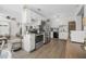Well-equipped kitchen with stainless steel appliances, white cabinets, and modern flooring at 2216 Umbrella Tree Dr, Edgewater, FL 32141