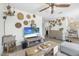 Bright living room featuring stylish decor, modern furniture, and ample natural light at 2216 Umbrella Tree Dr, Edgewater, FL 32141