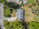Aerial view showcasing the home, driveway, roof, and outdoor space at 2249 Swoope Dr, New Smyrna Beach, FL 32168