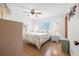 Charming bedroom with a ceiling fan, a window, and hardwood floors at 2249 Swoope Dr, New Smyrna Beach, FL 32168
