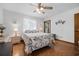 Bright bedroom with a ceiling fan, a window, and hardwood floors at 2249 Swoope Dr, New Smyrna Beach, FL 32168