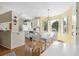 Bright dining area with table, chairs, and large windows at 2249 Swoope Dr, New Smyrna Beach, FL 32168