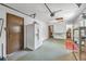 Spacious garage featuring a refrigerator, workbench area, and garage door at 2249 Swoope Dr, New Smyrna Beach, FL 32168