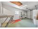 Well-lit garage featuring a workbench and storage racks at 2249 Swoope Dr, New Smyrna Beach, FL 32168