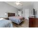 Calm bedroom with two beds, wood floors, neutral colors, and minimal decor for a relaxing atmosphere at 2344 Kelbrook Ct, Oviedo, FL 32765
