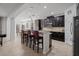 Beautiful kitchen with dark cabinets, stainless steel appliances, a breakfast bar, and tiled flooring at 2344 Kelbrook Ct, Oviedo, FL 32765